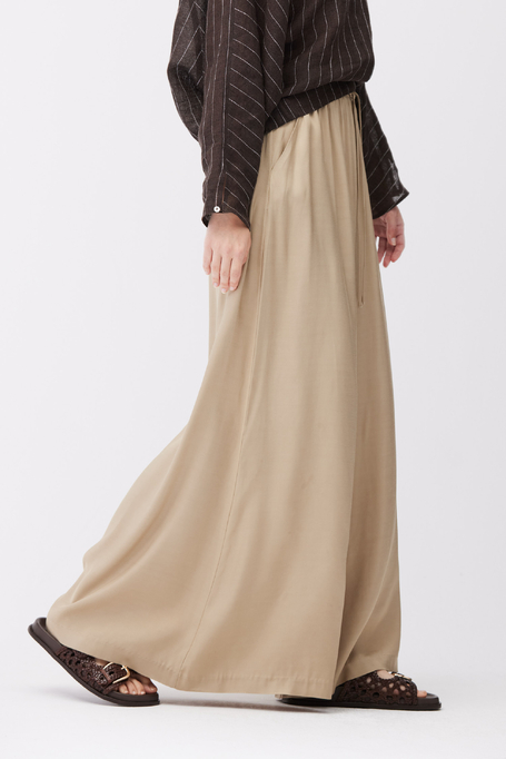 Beżowe spodnie z szeroką nogawką i gumką w talii damskie - Patrizia Aryton